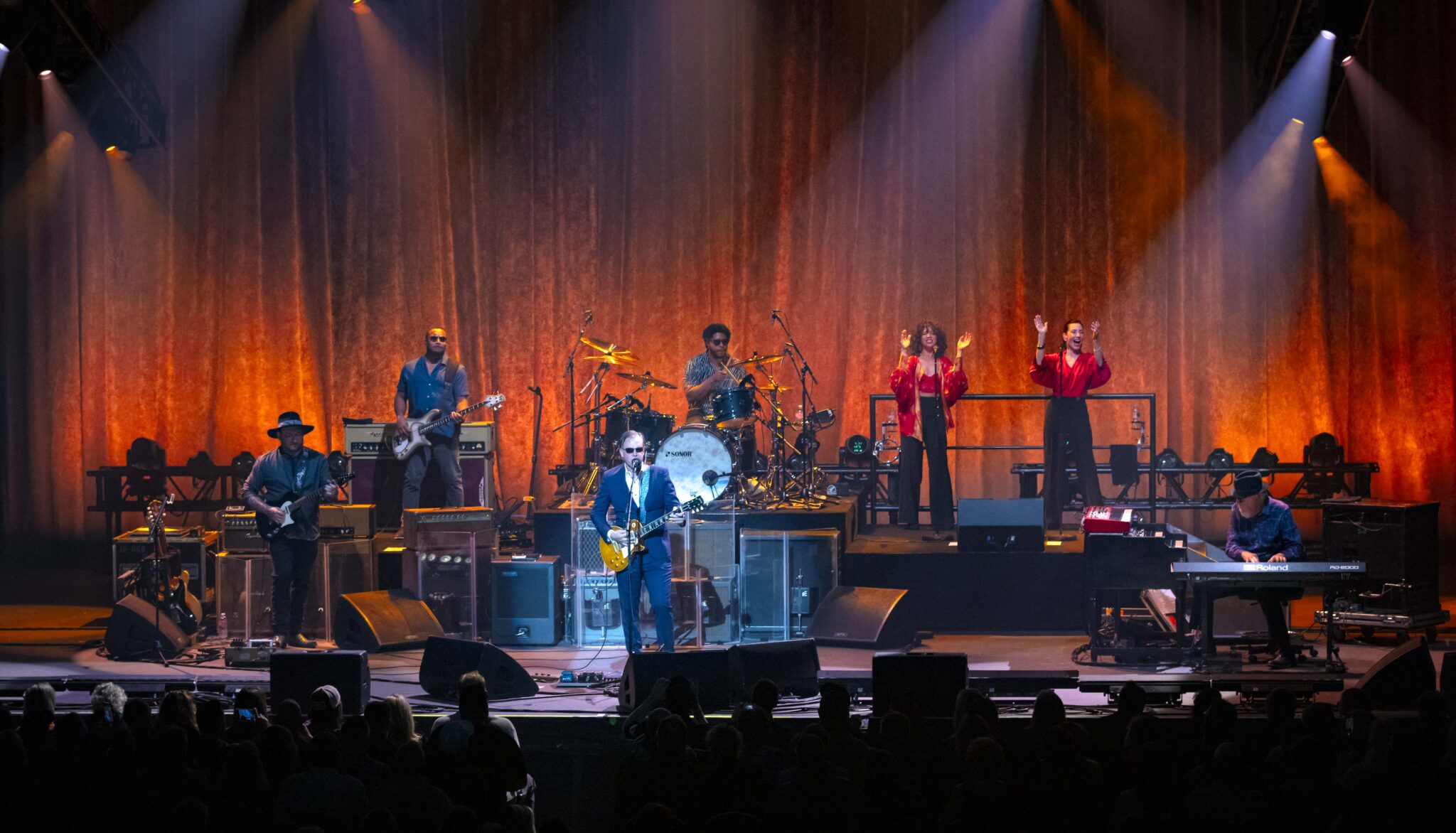 A band on the stage begins the first song of a concert.