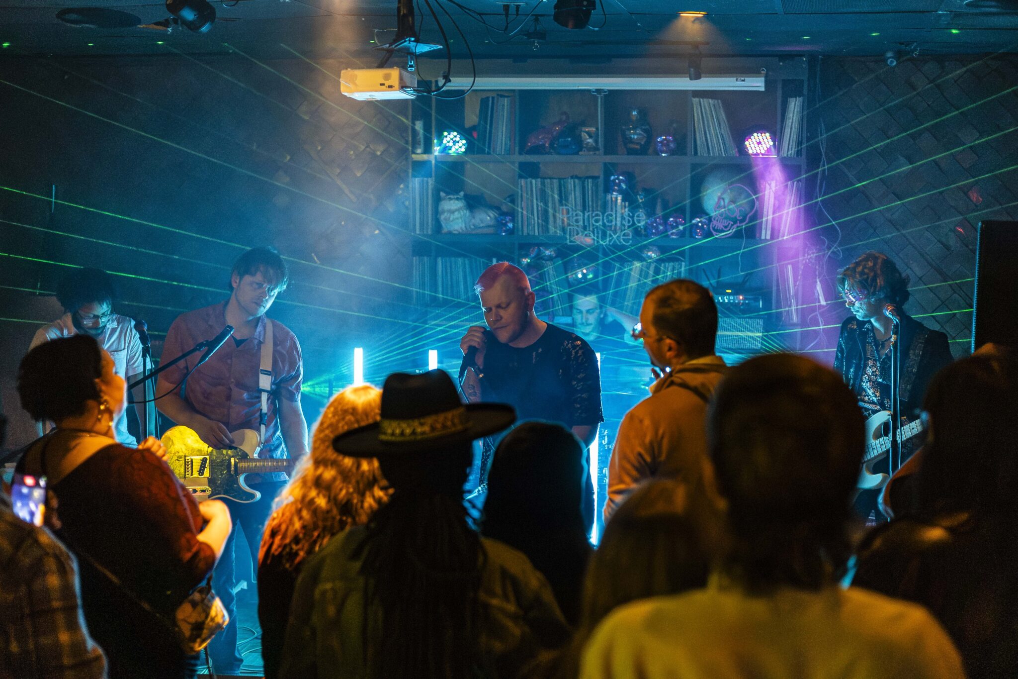 A band plays live music in front of a crowd